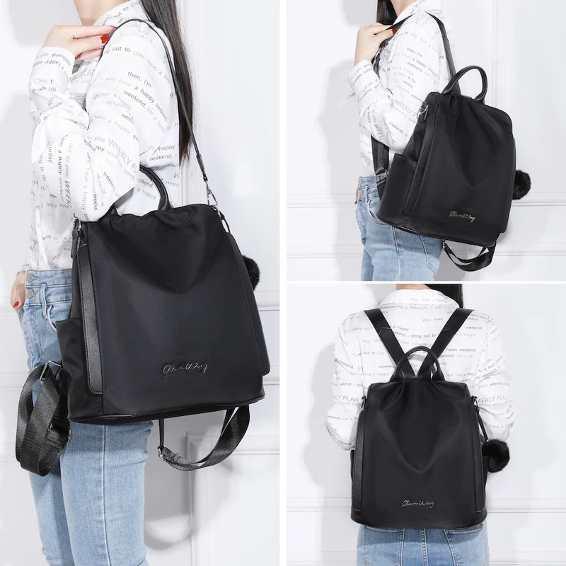 Mochila antirrobo Impermeable para mujer (14.80L) | Mochila Convertible en bolso con pompón y asa desmontable de adorno Negro