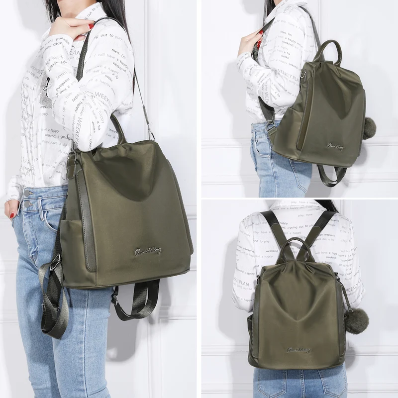 Mochila antirrobo Impermeable para mujer (14.80L) | Mochila Convertible en bolso con pompón y asa desmontable de adorno Verde