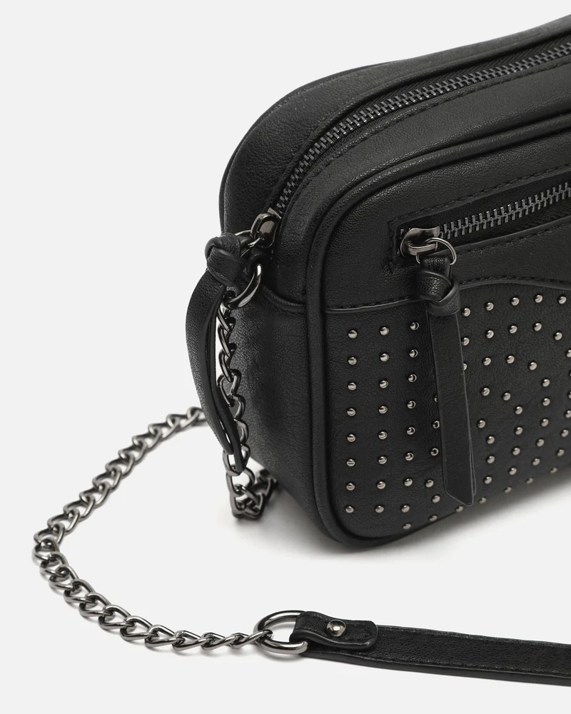 Koretos bolso bandolera pequeño con detalles metálicos