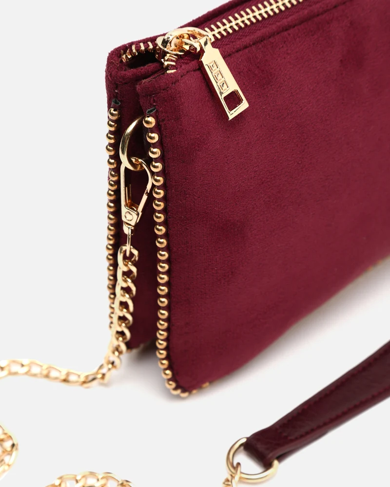 Boleo bolso bandolera efecto ante y con detalles metálicos